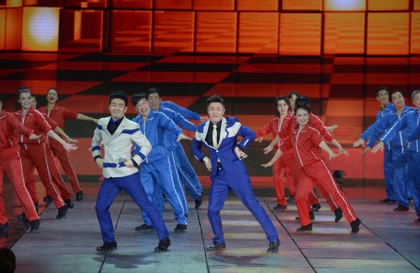 《小蘋果》、《最炫民族風》等廣場舞曲將會有全國統(tǒng)一、編排科學、帶給人正能量的全新動作。 CFP 資料